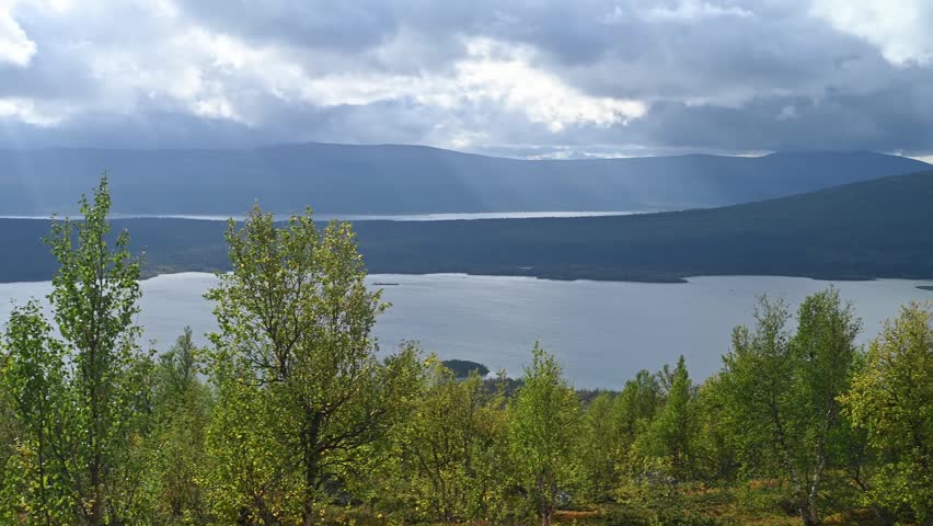 moody Stormy Sky Over Mountain Lake and Birch Forest in Sarek National Park, Swedish Lapland