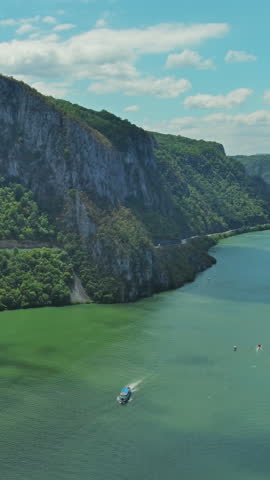 Aerial view on the Danube river and mountains in Iron Gate, Djerdap National Park, Serbia Romania border. Vertical video 4k