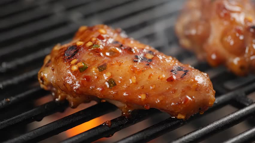 4K Baking hot and spicy grill chicken wings in the oven with grain processed.
