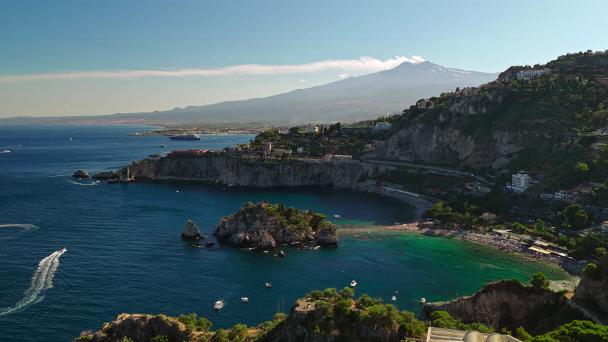 Italy Sicily Aerial Slow Pan Establish of Taormina Isola Bella Bay and Mount Etna Volcano