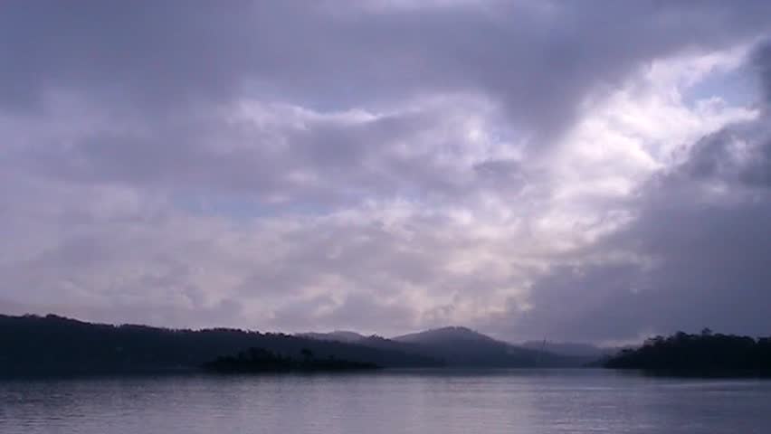 View across lake at a cloudy sky on a winter day