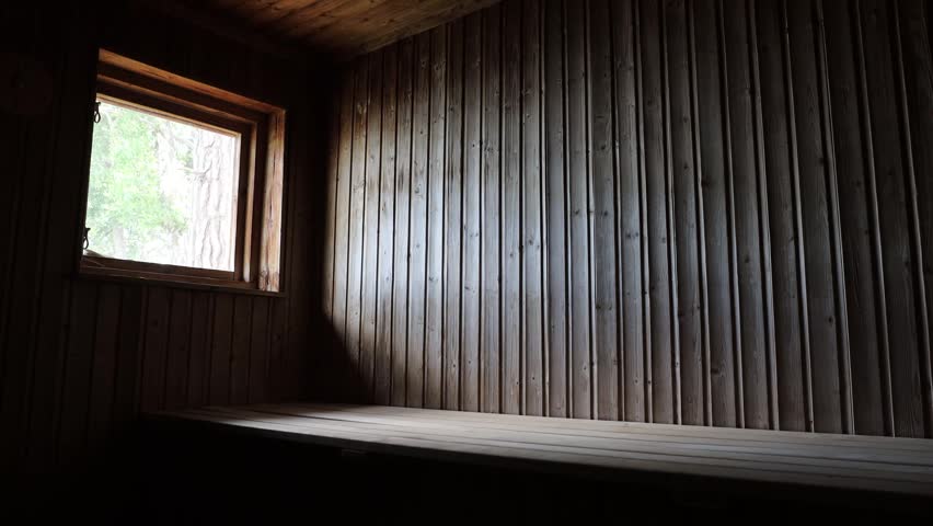 Stockholm, Sweden A man does exercises in a warm wooden sauna. 