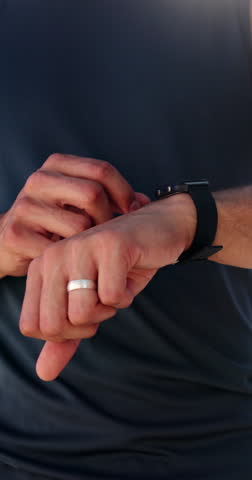 Fitness, man and hands typing with smart watch for heart rate tracker, exercise and check wellness. Flare, male person and runner with wearable tech for cardio training, monitor step count and timer.