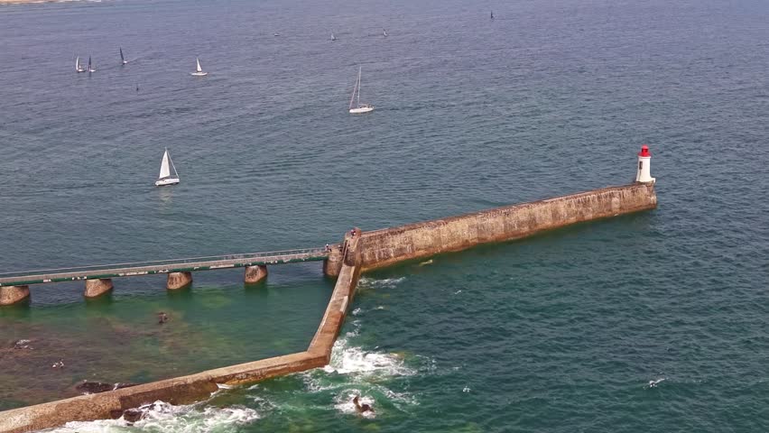 Grande jetée with lighthouse, sailboats in ocean waters, Les Sables-d