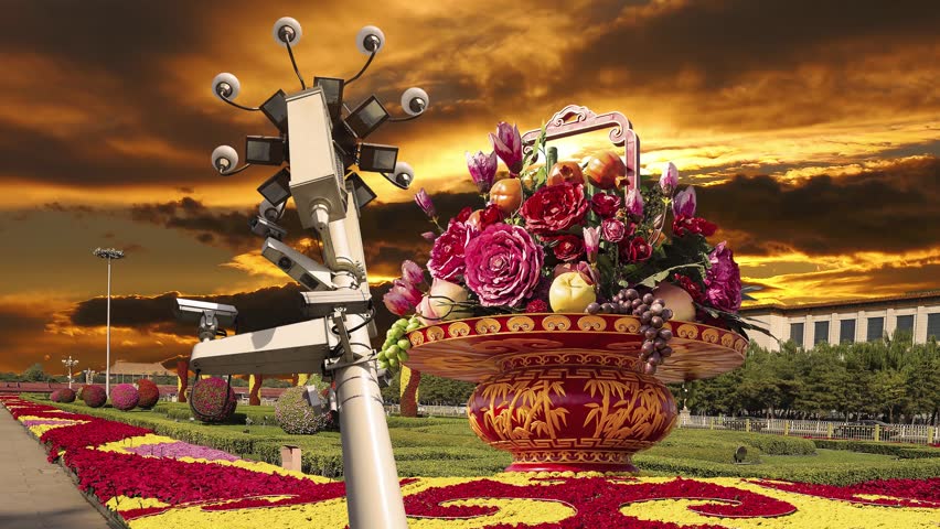 Street lamp and huge flower basket (against the sunset) in Tiananmen square, Beijing, China. 4K, time lapse 