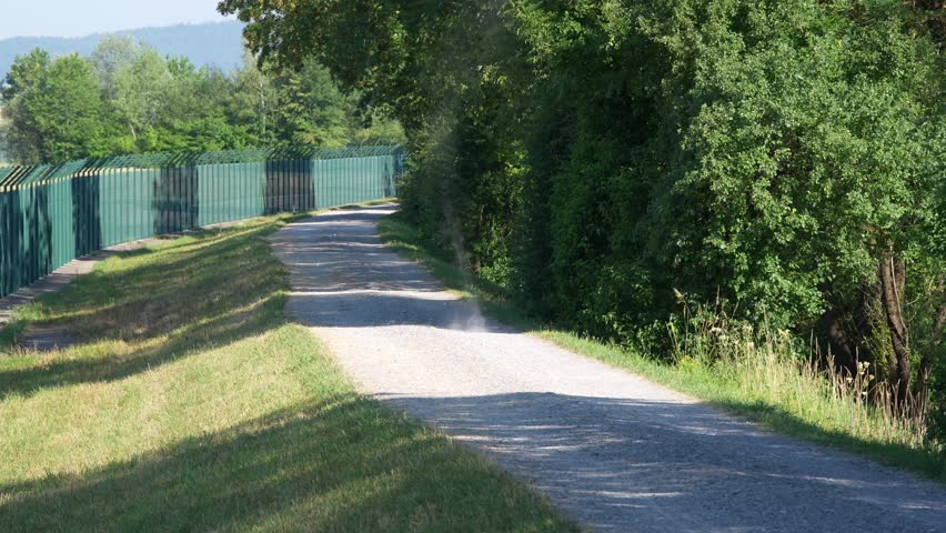 Idyllic landscape scenery with small tornado building vortex of dust on a sunny hot summer morning near the Zürich Airport. Video shot June 25th, 2026, Zurich Kloten, Switzerland.