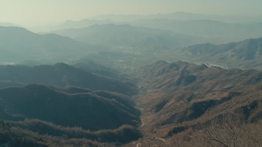 Beijing Panoramic aerial view of misty mountain valleys and rural settlements
