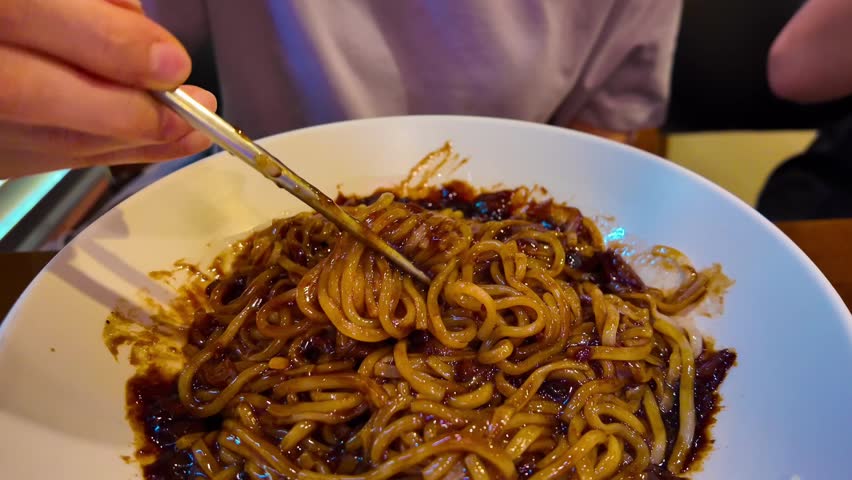 Jajangmyeon - Korean Chinese pork and vegetables in black bean paste noodles