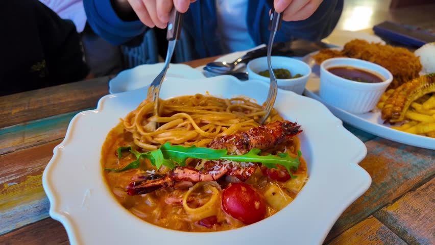 Spaghetti with shrimp and olive oil with garlic sauce. Shrimp pasta in a plate
