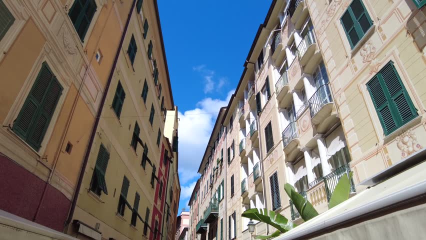 Europe, Italy , Liguria, 06,27,2026   Santa Margherita Ligure close to Portofino is a colorfull sea village tourist attraction destination for summer holidays - typical colorful houses with a view of the sky