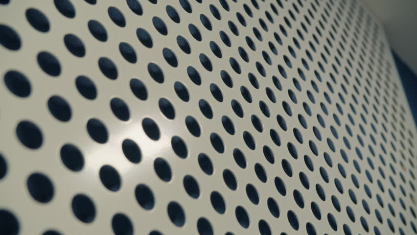 Perforated metal panel abstract geometric texture