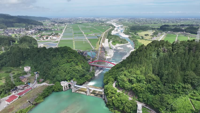 The area around Aimoto Bridge, which spans the Kurobe River in Toyama Prefecture, Japan, during the rainy season
