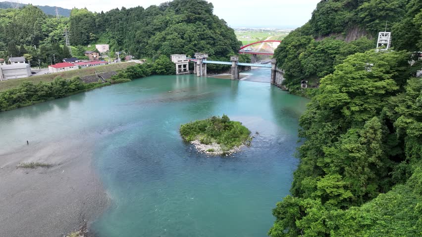 The area around Aimoto Bridge, which spans the Kurobe River in Toyama Prefecture, Japan, during the rainy season