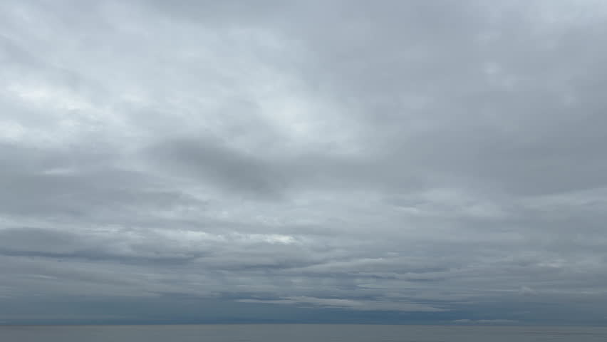 A peaceful sea landscape under a cloudy sky