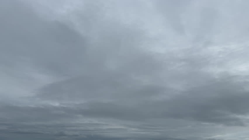 A peaceful cloudy sky landscape with thick clouds spreading across the sky