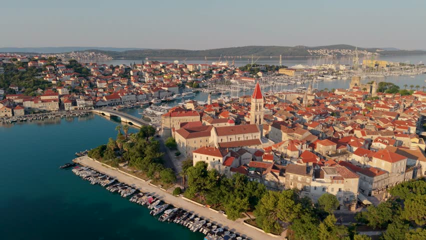 Croatia offers breathtaking views of Trogir, where historic buildings meet turquoise waters. Discover charming streets, vibrant boats, and picturesque landscapes that define this coastal gem.