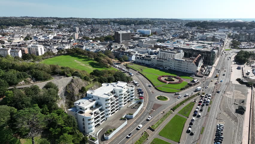 An aerial footage of St Helier, the capital of Jersey, the largest of the Channel Islands in the English Channel on a sunny day