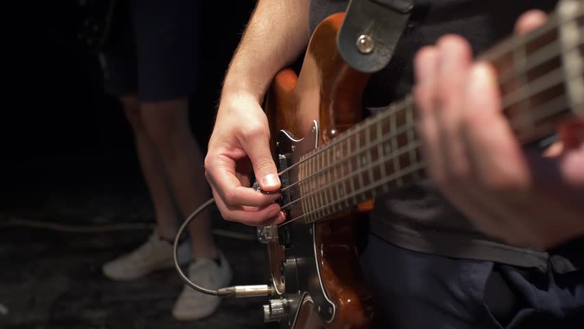 Playing Bass Guitar On The Stage