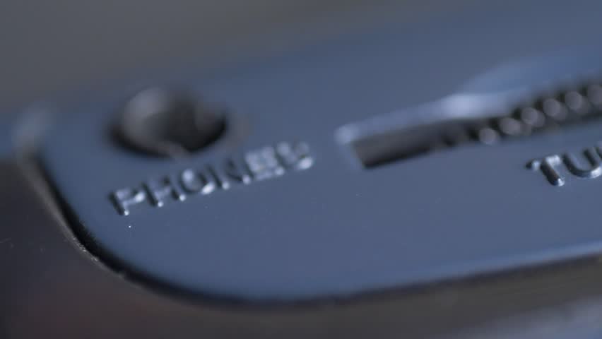 Tuning wheel, headphone jack. Concept of personal sound environment. Old retro radio or cassette player with radio function