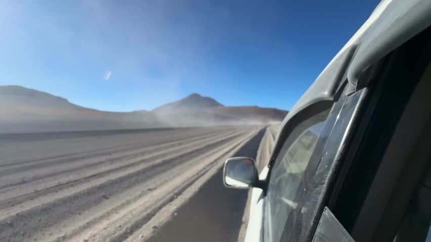 Car driving  at Salar de Uyuni in Bolivia