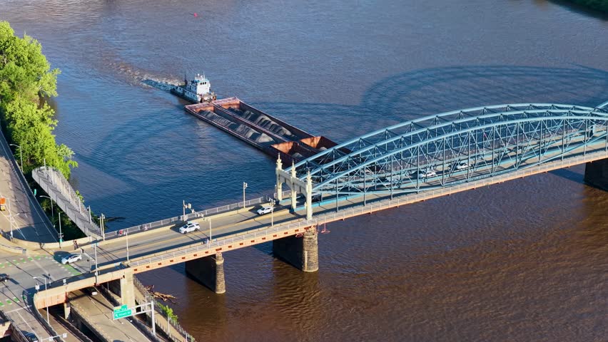 Cars driving over a bridge along the Monongahela River in Pittsburgh Pennsylvania USA