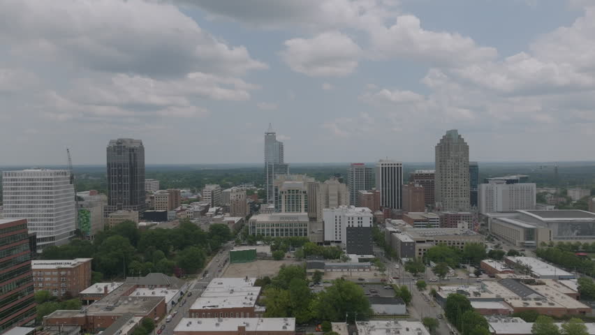 Drone footage of downtown Raleigh, North Carolina on a partly cloudy summer day.