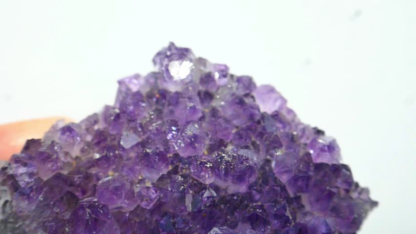 amethyst geode with sparkling purple crystals. Purple crystals.Radiant texture of agate stone. 4k footage