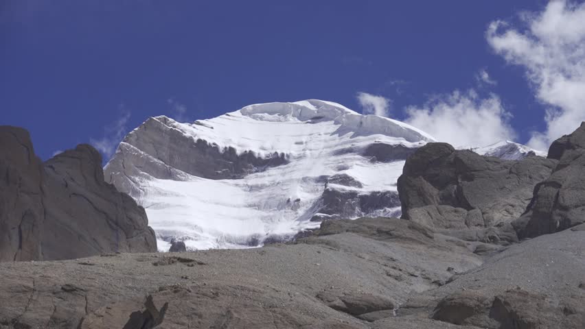 Majestic footage of Mount Kailash, Tibet’s sacred peak revered across cultures, rising above the vast Himalayan plateau.