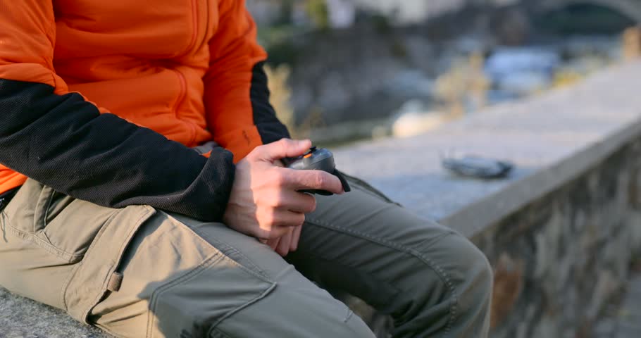 Cropped View Of A Man With DJI RC Motion 3 Controller. Enables Intuitive Drone Flight Through Wrist Gestures. Close-up Shot