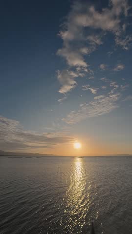 Timelapse of Sunset Over Calm Water