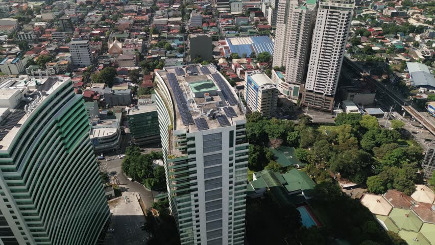 Overhead drone shot of urban development, corporate towers and residential neighborhoods in Cubao, Metro Manila, Quezon City, Philippines