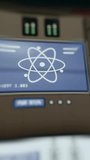 Monitor showing an atom symbol, nuclear engineering concept - Powered by Shutterstock - Get 15% off with code: PIKWIZARD15