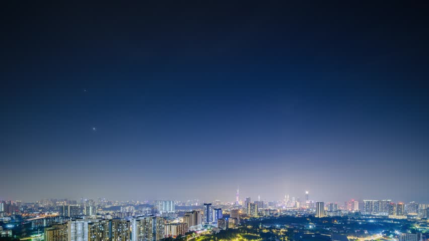 Aerial birds eye view of Kuala Lumpur, Malaysia cityscape at night time lapse, wide angle