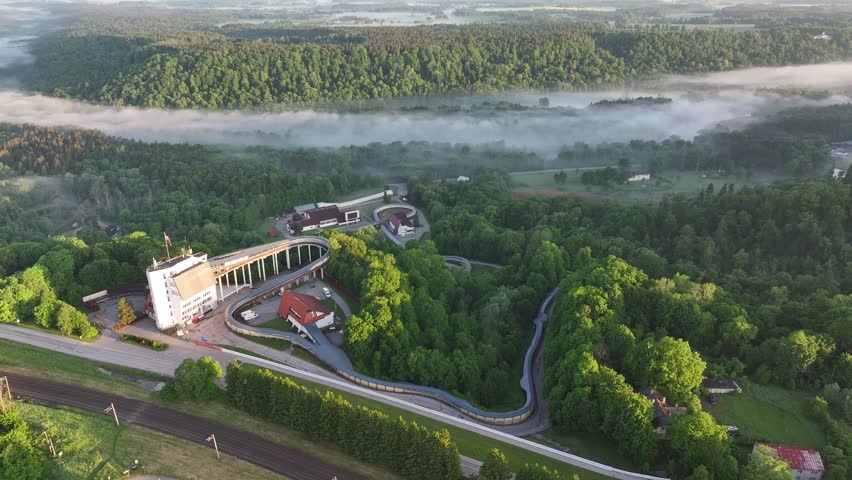 Sigulda Bobsleigh and Luge Track Above the Misty Gauja Valley at Sunrise, Latvia