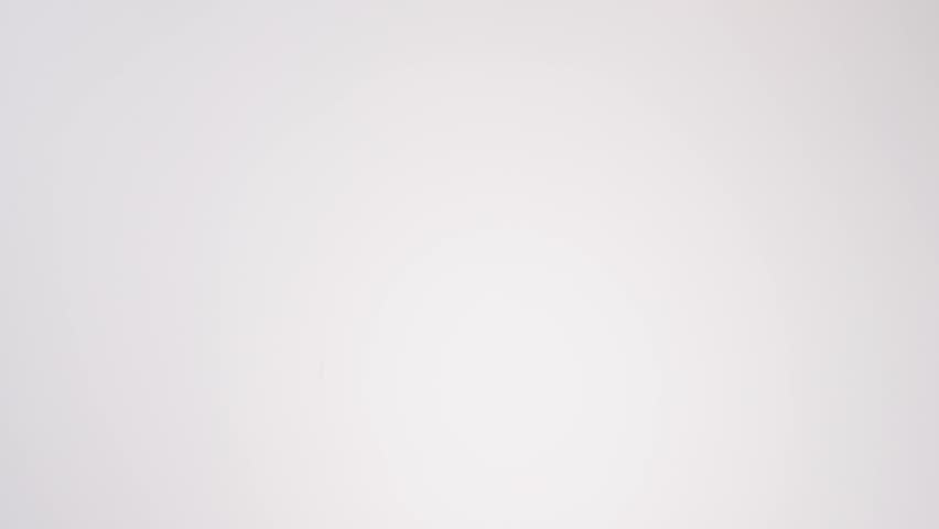 Colorful sprinkle-topped donuts raining down on white seamless backdrop in cinematic slow motion. kids birthday party reels, celebration content, festive party posts.