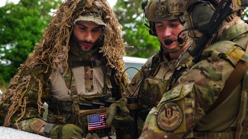 A group of soldiers in uniform held a meeting before heading out for military exercises.

