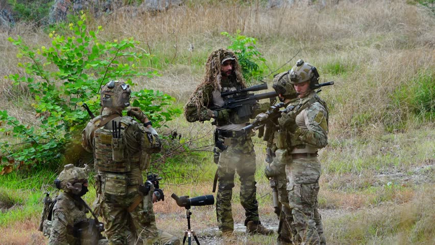 A group of soldiers from several nations, dressed in military uniforms and carrying BB guns, held a meeting, conducted drills, and played games.

