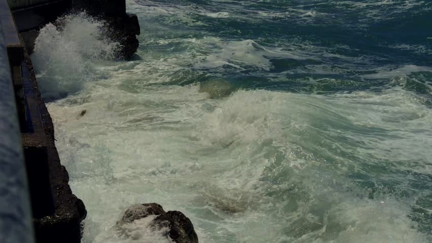 Stormy Sea Waves Crashing On Concrete Pier During Summer Storm Close Up. Powerful Ocean Water Splash Against Coastal Breakwater. Marine Nature Landscape Dramatic Water Turbulence Coastal Erosion Travel Vacation Environment Summer Stormy Sea Waves Crashing Concrete Pier Powerful Ocean Water Splash