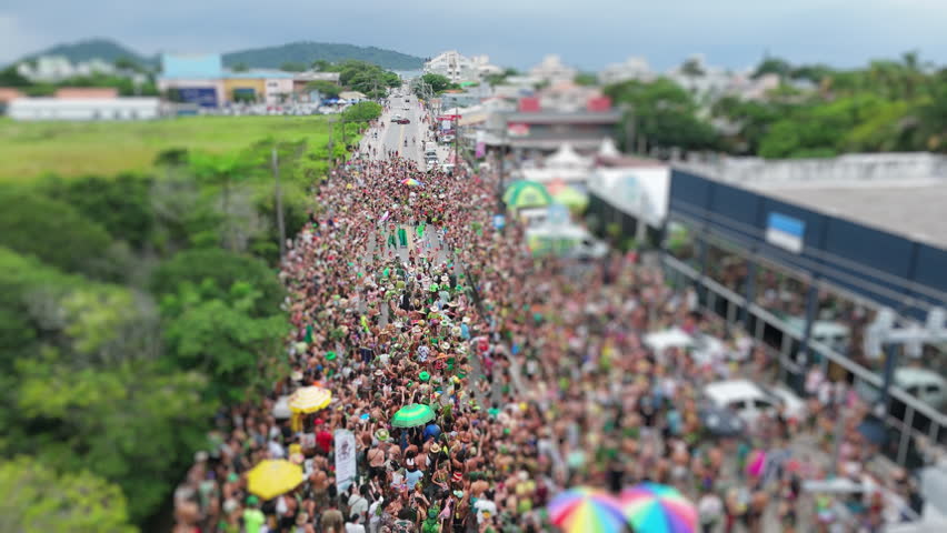 Aerial view of the street block carnival named Samambloco on the street of the town of Campeche, Florianopolis, Brazil