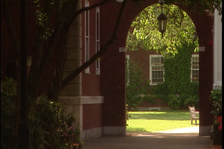 CAMBRIDGE, MASSACHUSETTS - MAY 20, 2004: Brick archway leading to dormitory courtyard.