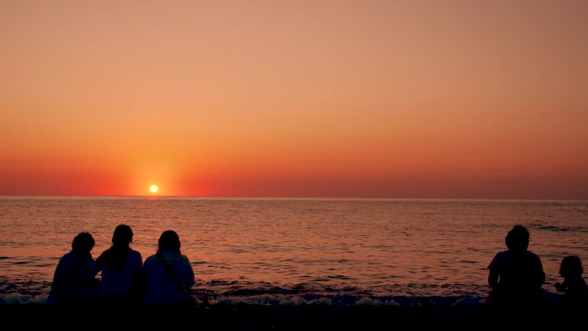  Batumi, Georgia- 29 Dec June 2026, People silhouette relaxing  against the beautiful sunset over the sea.