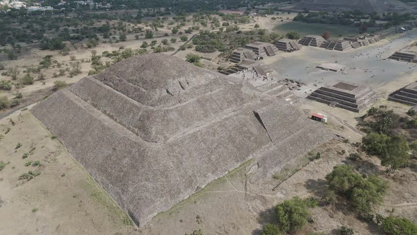 Aerial perspective of the ancient teotihuacan archeological site, featuring the pyramid of the sun and the avenue of the dead, revealing the vastness of this pre aztec mesoamerican city