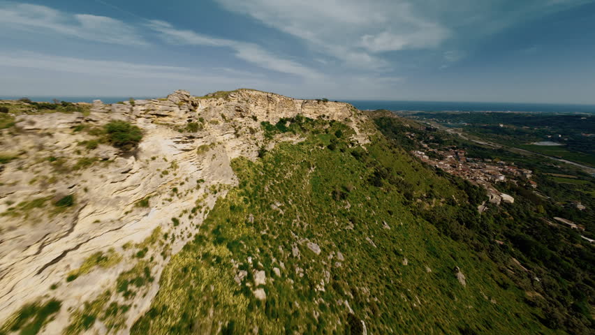 Aerial view of rocky hill and vegetation
