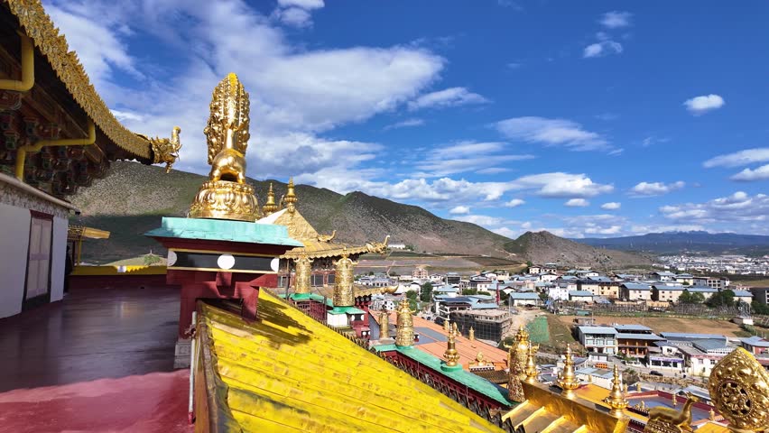 Shangri La, China : Tilt down footage from the prayer hall roof of the tibetan Buddhism Songzanlin Monastery overlooking the Shangri-La landscape in the mountains of Yunnan, China