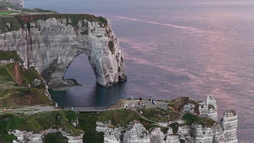 Etretat France natural arches and dramatic cliffs at dusk