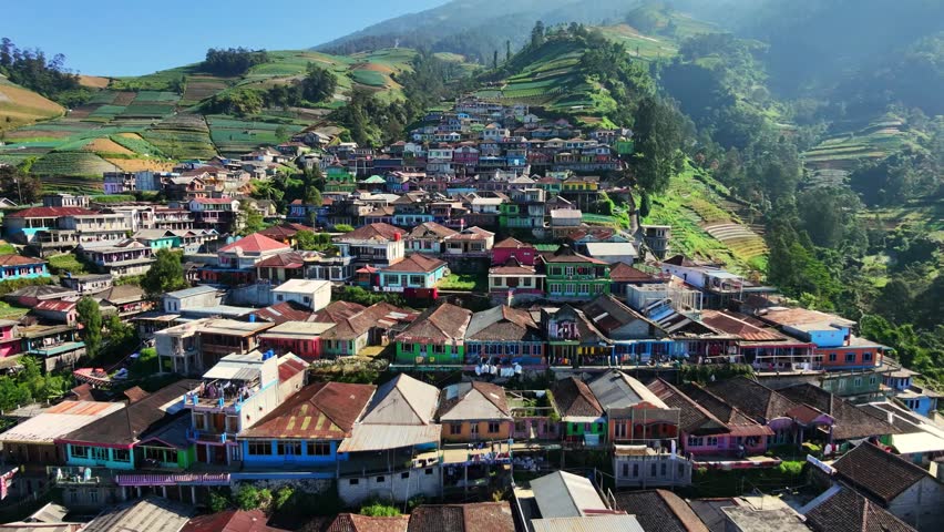 Aerial view of a house at the foot of a mountain