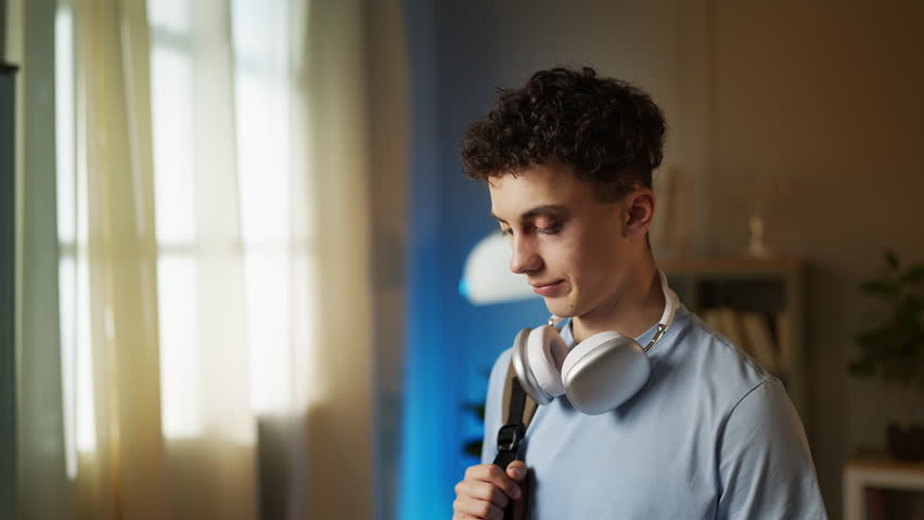 Portrait of sad teen boy with a bruised eye looking into camera, school bullying