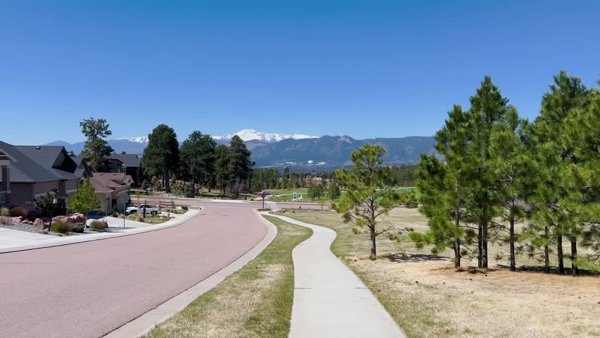 Neighborhood road with Pikes Peak
