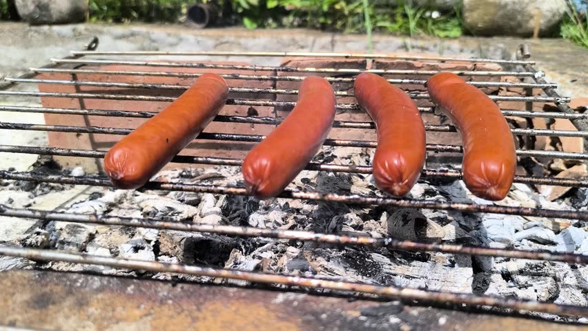 Close-up of barbecued sausages, whetting the appetite and providing culinary pleasure.
