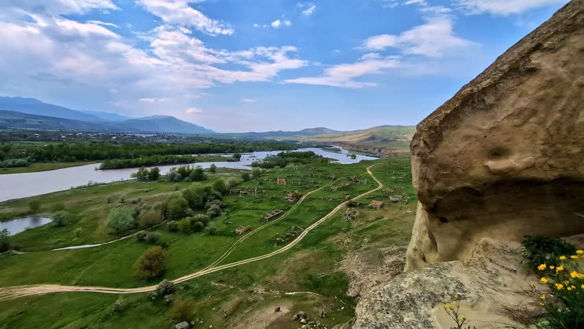 Watch a scenic panoramic pan shot overlooking the wide Kura River from Uplistsikhe cave town.